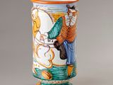 a vase with a picture of a man riding a horse on it
