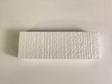 a piece of white paper on a white surface
