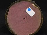 an image of a close up of a piece of wood with a sticker on it