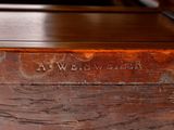 a close up of a wooden table with a sign on it