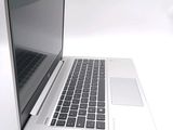 a close up of a laptop computer on a white surface