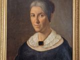 portrait of an old woman in a black dress with a white collar