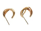 pair of gold tone earrings with curved design on a white background
