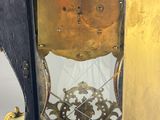 a clock that is sitting in the corner of a room
