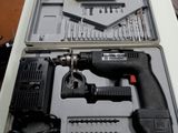 a black and decker drill in a case on a table