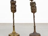 pair of antique brass candlesticks on cast iron bases