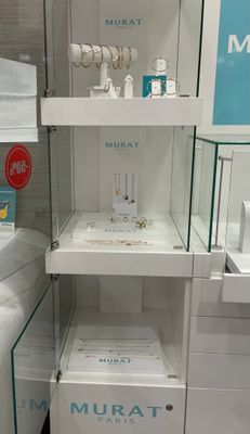 a display case with many items in it in a store