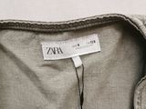 a close up of a shirt with a tag on it