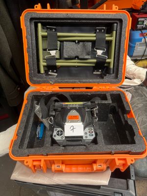 an orange case that has a camera inside of it