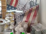 many items on display on a table in a room