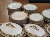 a lot of plates that are sitting on a table