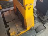 a yellow machine that is sitting on the ground