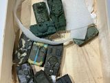 toy army vehicles in a wooden box on a white surface