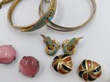 a lot of jewelry on a white table