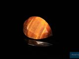 a close up of a rock in the dark with a light shining on it