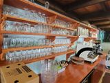 many glasses on the shelves in the kitchen