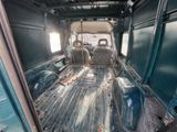 a view of the inside of a truck with the door open