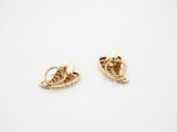 a pair of gold plated earrings on a white background