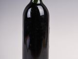 a bottle of wine that is sitting on a table