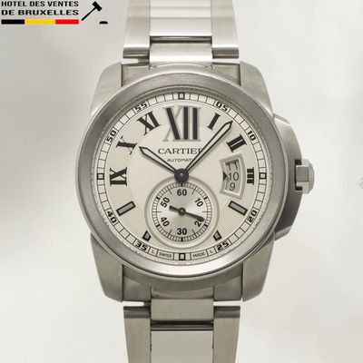 a close up of a wrist watch with roman numerals
