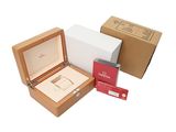 a box with a watch inside of it and a box with a watch inside of it