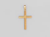 pendentif en forme de croix en or sur fond blanc