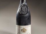 a bottle of wine that is sitting on a table
