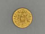 a gold sovereign coin with a crown on it