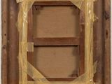 an image of a picture frame is wrapped in plastic and sitting on a shelf