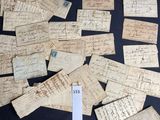 several pieces of old paper with writing on them on a table
