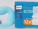 a box of toilet paper and a blue toilet seat