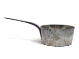 a small metal saucepan with a spoon in it