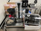 a blender sitting on top of a counter next to a blender