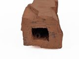 a small dog that is sitting in a small brick
