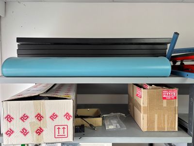 a shelf that has a bunch of boxes on it