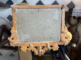 a mirror that is sitting on a table next to a teddy bear