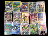a lot of pokemon cards that are on the table