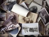 a pile of old photos that are on a table