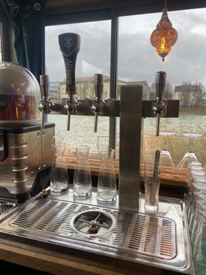 a sink with a faucet and a bunch of glasses on it
