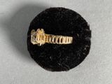 an image of a gold ring with a diamond on top of a black velvet ball