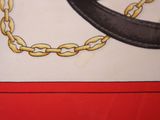 a picture of a cake with a chain and a hat on it