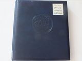 a black book with a picture of a ship on it