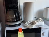 a microwave and a coffee maker sitting on a counter