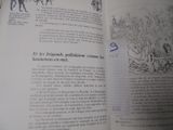 un livre ouvert avec le dessin d'un homme sur un cheval