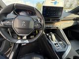 the interior of a car with a steering wheel and dashboard controls