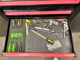 a tool drawer with tools in it on the floor