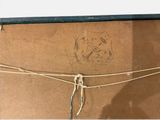 a drawing of a dog on a piece of cardboard on the wall