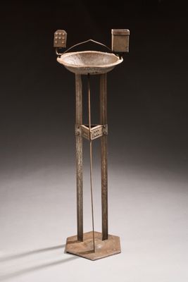 an image of a metal stand with a bird on it