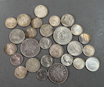 a lot of coins that are on the table
