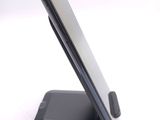 a cell phone that is sitting on top of a stand